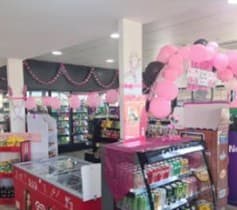 Store counter with McGrath Foundation pink balloons