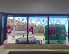 McGrath Foundation lettering on a store window