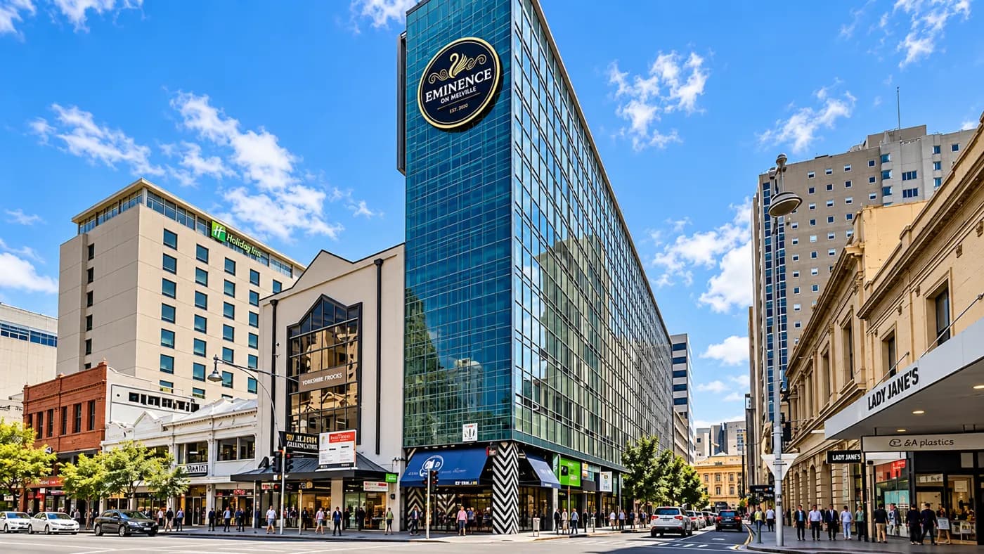 A city hotel tower at a downtown intersection