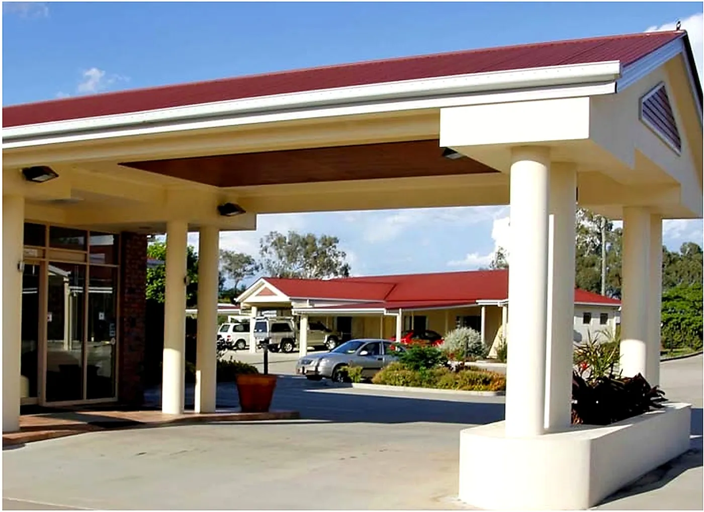A motel entrance and car park